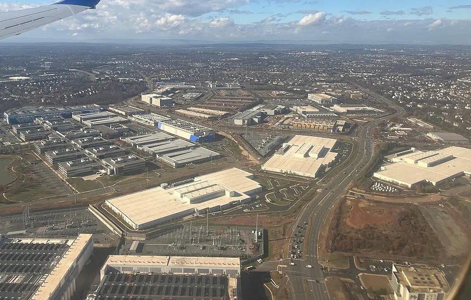 An aerial view of large, flat-roofed data centre buildings in Ashburn, Virginia