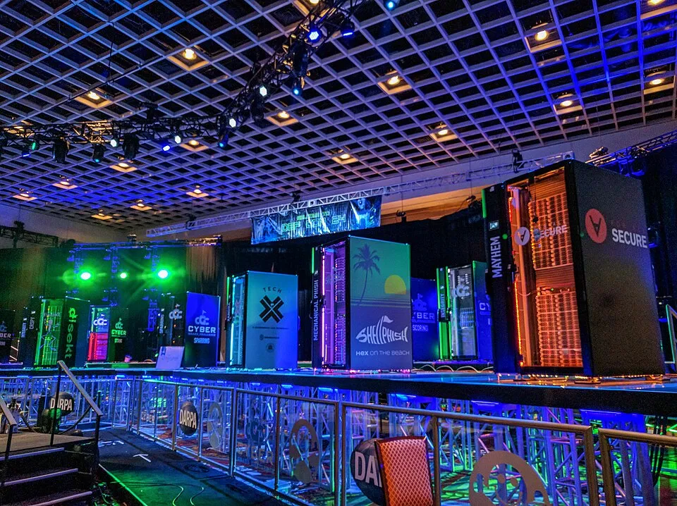 Brightly lit server racks of the competing machines at the DARPA Cyber Grand Challenge