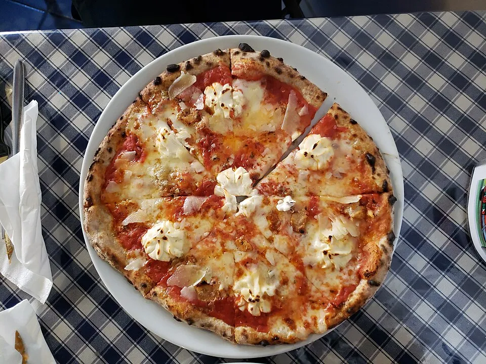 A cheese pizza on a table