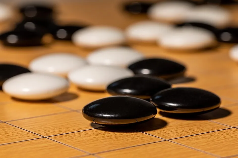 Black and white stones on a Go board