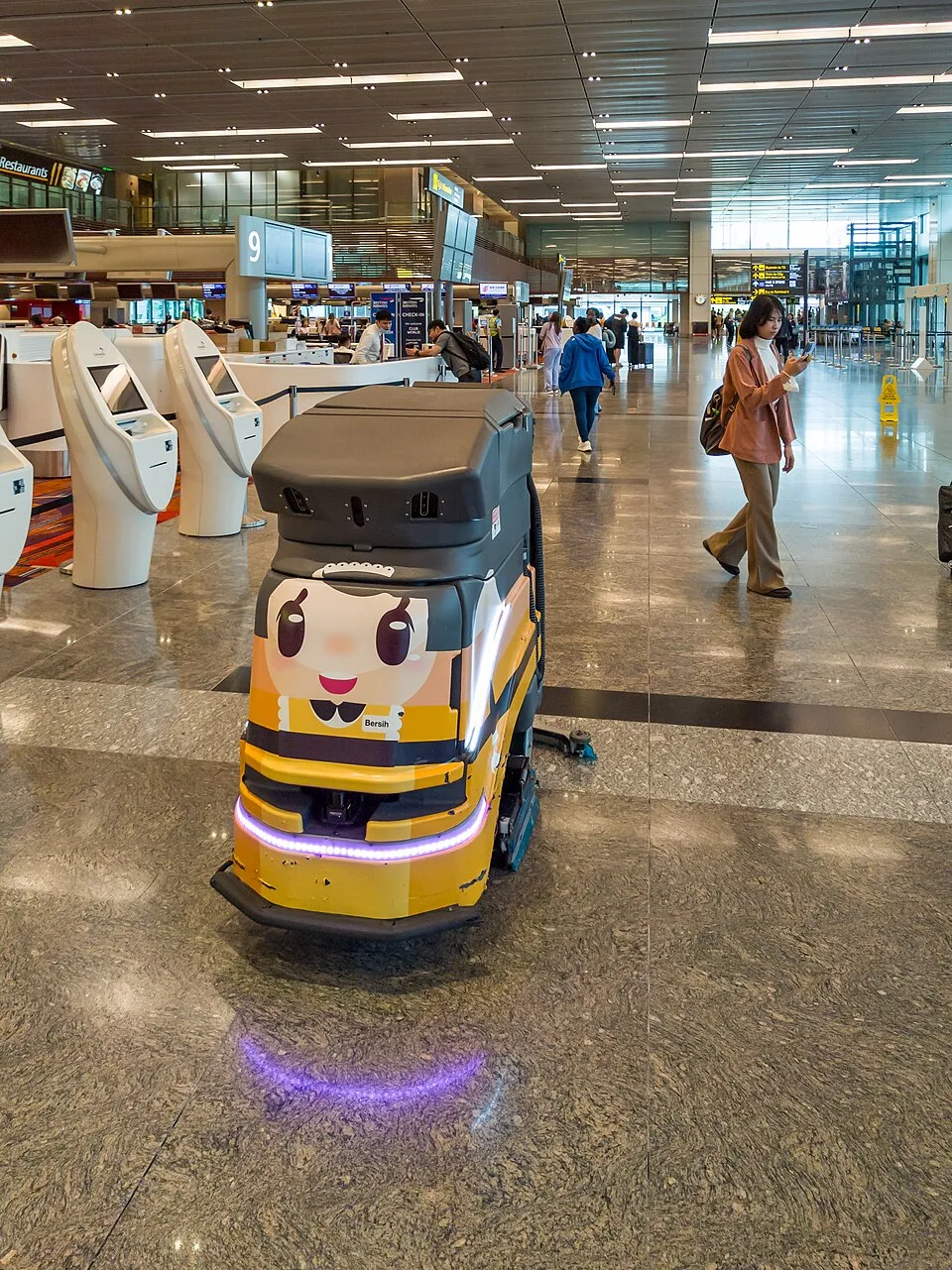 A cleaning robot at work in a public building