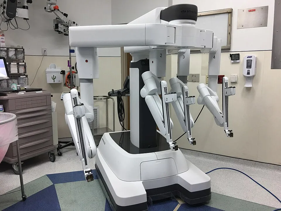 A da Vinci Xi surgical robot with four arms in an operating room