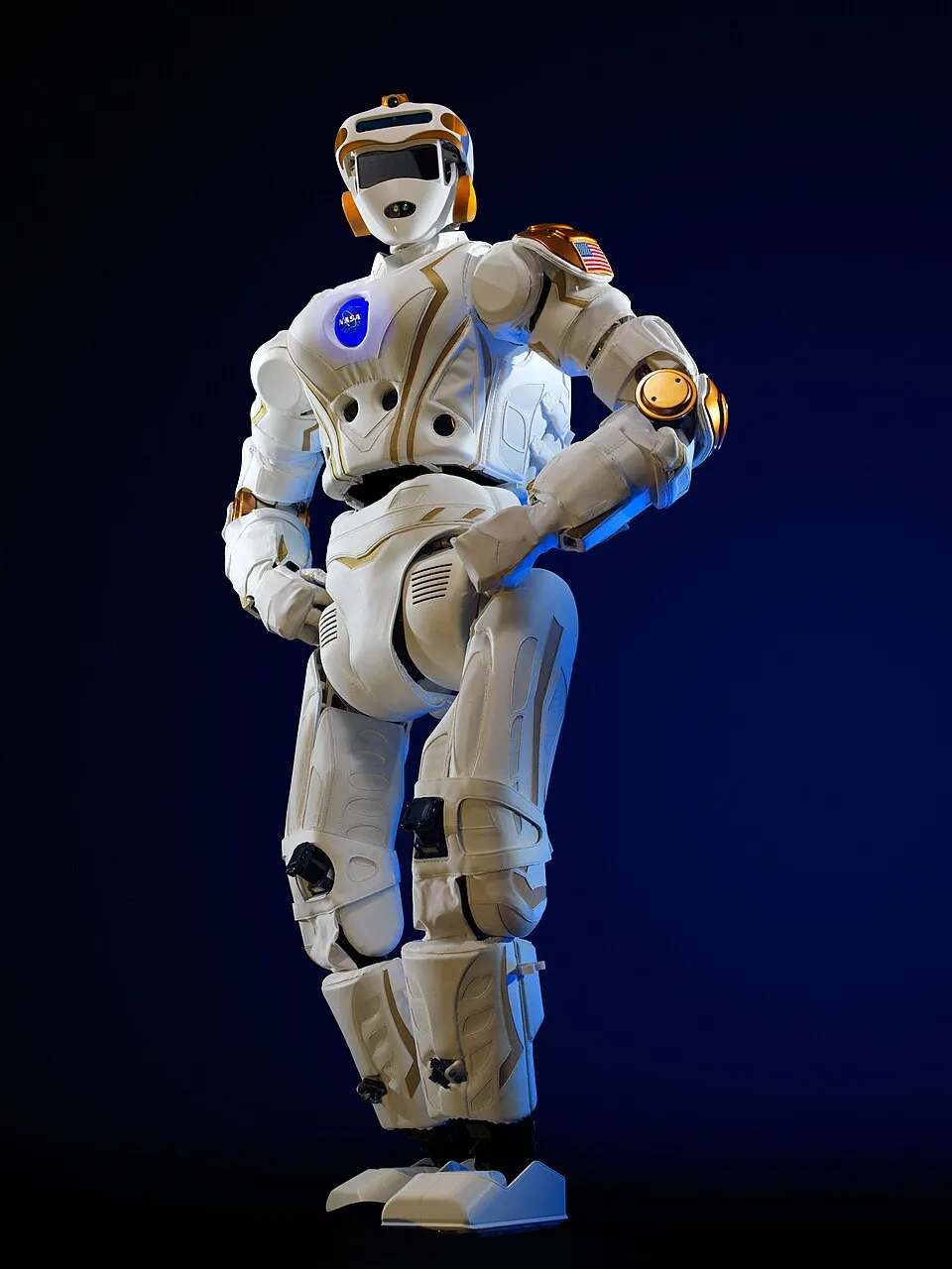 NASA's Valkyrie humanoid robot, white with gold joints, against a dark background
