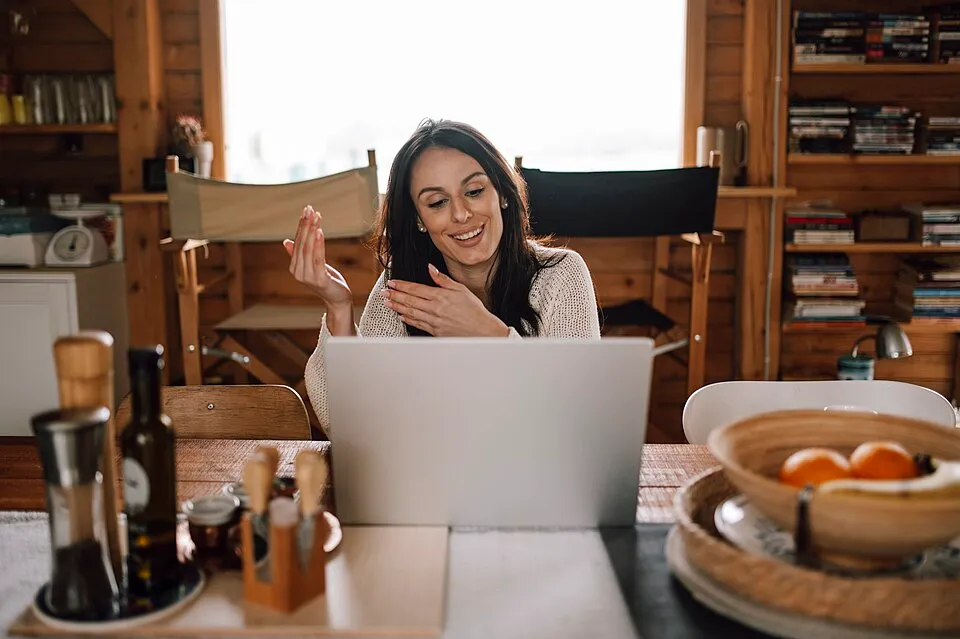 A woman on a video call on her laptop